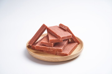 A plate of Hawthorn slices on a white background