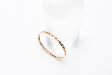 The gold bracelet isolated against a white background