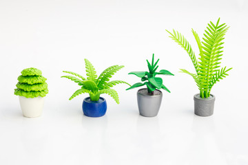 Detail of plastic toy plants in isolated white background