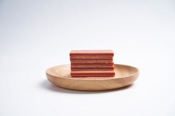 Fruit sandwich hawthorn slices in a wooden tray, he in a white background