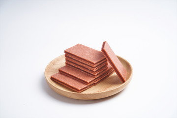 Fruit sandwich hawthorn slices in a wooden tray, he in a white background