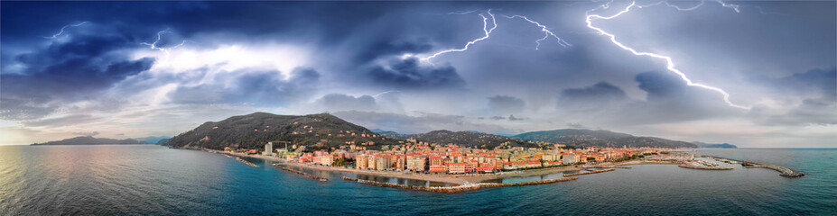 Fototapeta na wymiar Chiavari aerial view from the sea with storm approaching, Italy