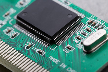 computer processor chip on a circuit board with microchips and other electronic parts CPU Chip on Motherboard