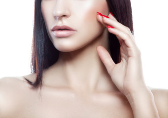 Lips, part of face, shoulder. Attractive beautiful young woman with perfect skin, day nude make-up, red nail manicure
