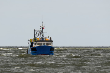 FISHING - A fishing boat on a stormy sea 
