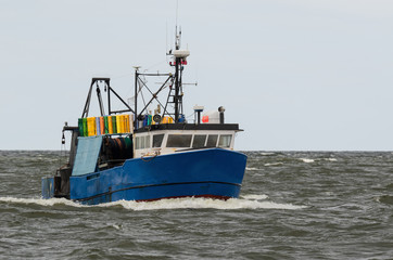 Fototapeta premium FISHING - A fishing boat on a stormy sea 