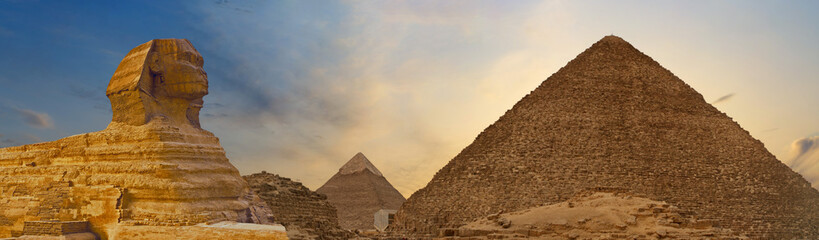Fototapeta na wymiar Sphinx against the backdrop of the great Egyptian pyramids. Africa, Giza Plateau.