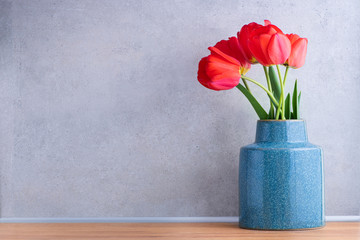 Fresh beautiful flowers tulips in scandinavian style vase