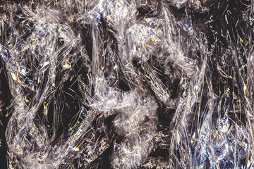 Cellophane abstract background. Plastic bag texture. Wrinkled iridescent transparent film.