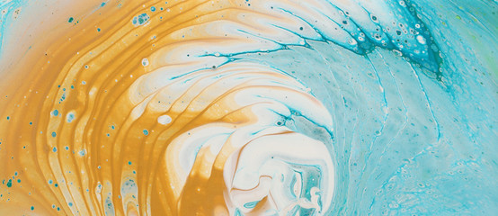 art photography of abstract marbleized effect background. Aqua, blue, gold and white creative colors. Beautiful paint