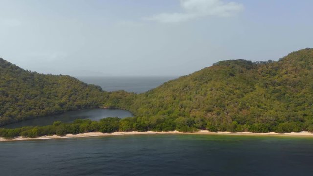 Epic aerial of a coastline with a salt pond on the island of Chacachacare in the Bocas del Dragon region of Trinidad and Tobago
