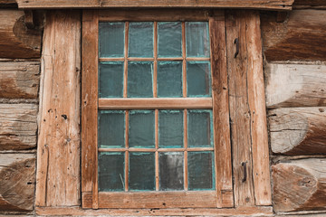 Fototapeta na wymiar Window of an old wooden house