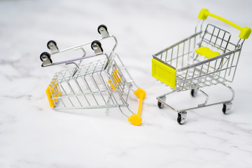 Shopping trolleys on light background