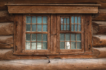 Fototapeta na wymiar Windows of an old wooden house
