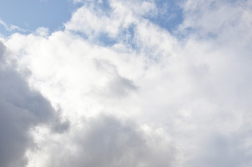 White clouds in blue sky without sun