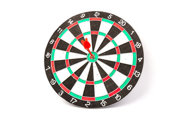Dartboard with darts on white background, closeup. Purpose concept