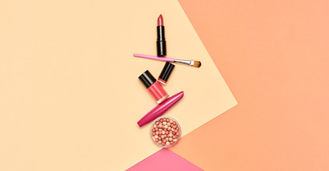Beauty cosmetic makeup set. Fashion woman make up product, brushes, lipstick, pop art flat lay. Creative vivid concept. Cosmetology make-up accessories on beige banner, top view