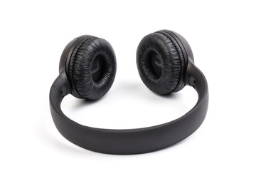 Black wireless headphones on white background.  Advanced acoustic stereo sound system
