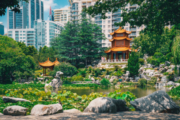 Beautiful Chinese garden and pond surrounding a pagoda contrasted by Sydney city in the background....