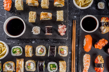 Japanese food. Big sushi set. Assorted set of various sashimi, maki and sushi rolls with different...