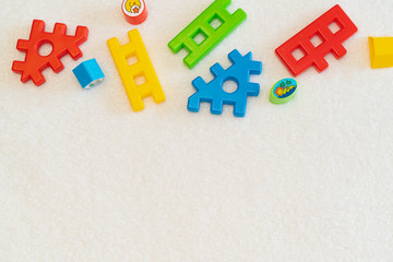 Colorful puzzles for kids on white background with copy space. Baby`s development concept.
