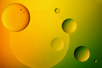 Oil drops on a water surface.