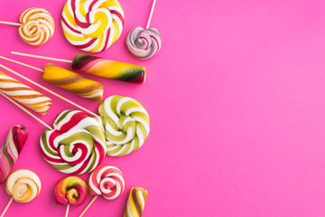 Lollypops sweet trend food on a pink