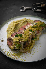 Grilled meat with pure on black background