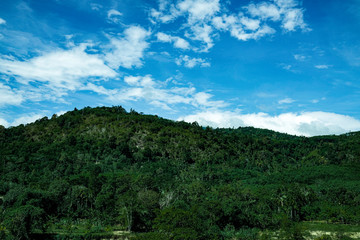 Fototapeta na wymiar Mountain green hill range a clouds panoramic landscape