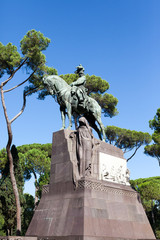 ROME, ITALY - 2014 AUGUST 17. A man and a horse sculpture in the street of Rome.