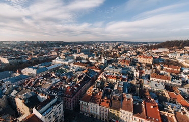 Fototapeta na wymiar View of the old city and people from above, from the observation tower of the town hall. Lviv, Ukraine, winter panorama. Aerial view.