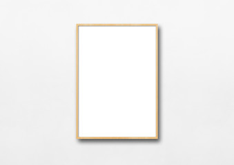 Wooden picture frame hanging on a white wall