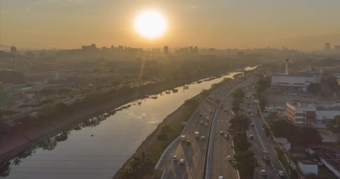 Aerial hyperlapse of heavy traffic in marginal tiete avenue during sunset in Sao Paulo, Brazil