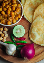 Chole Bhture or Chana masala is a Famous Indian dish originated initially from eastern Uttar Pradesh in the northern part of the Indian subcontinent.