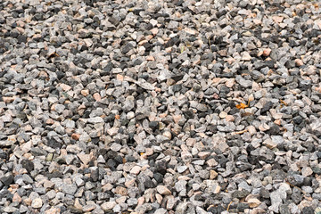 dark gravel pebbles stone texture . gray background
