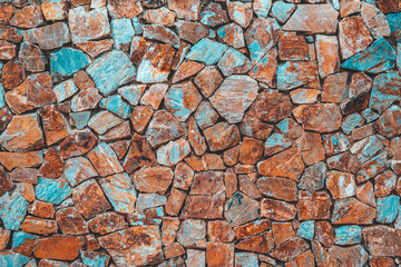 Stone or rock in concrete wall for background textured.