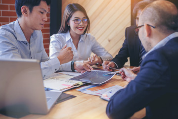 Businessman using hand gesture while explain business plan and discussion in the meeting. Selected...