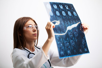Doctor examines an MRI image of the patient's brain