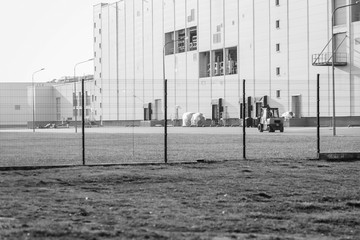 Asphalted yard with pallets on the territory of the factory