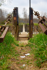 Fototapeta premium View of a bridge and some trash in the grass