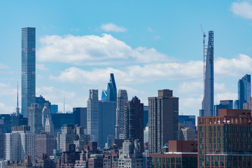 Fototapeta na wymiar Tall and Modern Skyscrapers in the Midtown Manhattan New York City Skyline