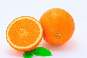 One orange fruit and half cut orange on white background
