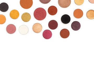Round multicolored make up eyeshadows isolated on white.