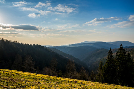 Germany, Beautiful sunset atmosphere over mountains silhouette in nature landscape of black forest scenery with view from brend mountain