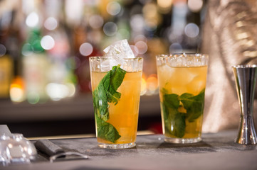 a fresh cocktail with lime, mint and ice and a little vodka