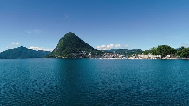 Aerial drone view over Lugano lake in the summer