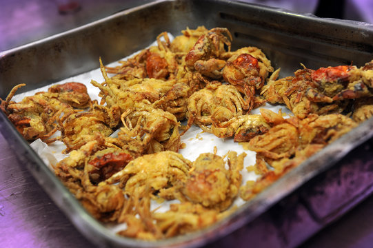 cooking typical Venetian little crabs called Moleche in fried oil
