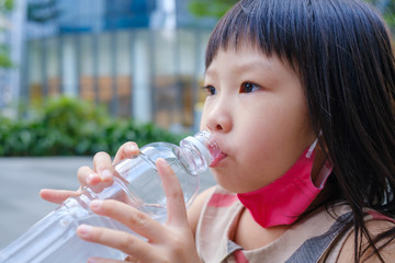Asian child drink water
