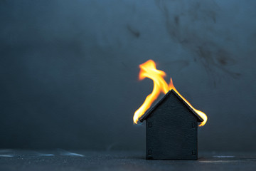 Black little wooden house caught fire