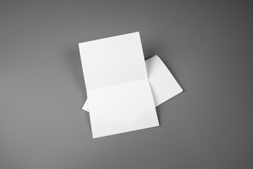 Blank portrait mock-up paper. brochure magazine isolated on gray, changeable background / white paper isolated on gray